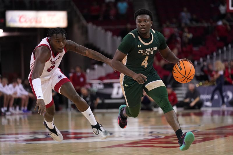 Feb 3, 2024; Fresno, California, USA; Colorado State Rams guard Isaiah Stevens (4) dribbles past Fresno State Bulldogs guard Jalen Weaver (5) in the first half at the Save Mart Center. Mandatory Credit: Cary Edmondson-USA TODAY Sports