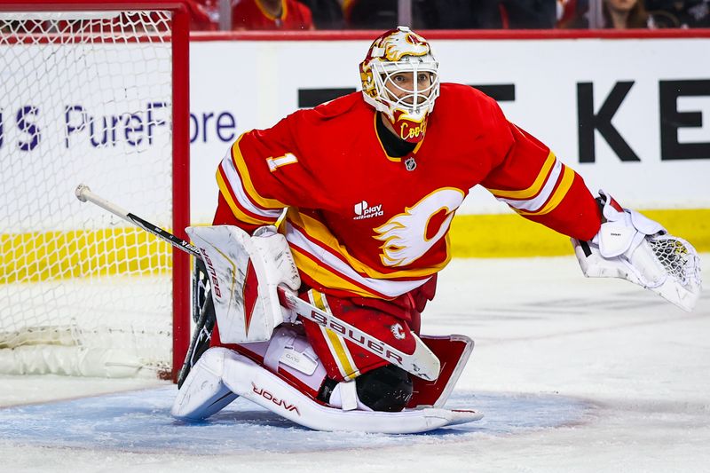 Jan 23, 2026; Calgary, Alberta, CAN; Calgary Flames goaltender Devin Cooley (1) guards his net against the Washington Capitals during the third period at Scotiabank Saddledome. Mandatory Credit: Sergei Belski-Imagn Images