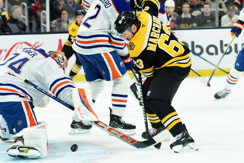 Jan 7, 2025; Boston, Massachusetts, USA;  Boston Bruins left wing Brad Marchand (63) looks for a rebound in front of Edmonton Oilers goaltender Stuart Skinner (74) during the first period at TD Garden. Mandatory Credit: Bob DeChiara-Imagn Images