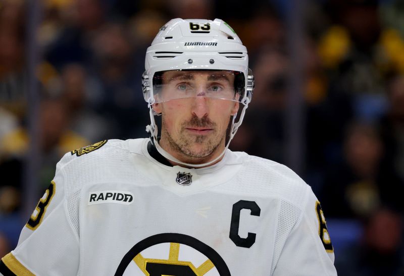 Dec 27, 2023; Buffalo, New York, USA;  Boston Bruins left wing Brad Marchand (63) during a stoppage in play against the Buffalo Sabres at KeyBank Center. Mandatory Credit: Timothy T. Ludwig-USA TODAY Sports