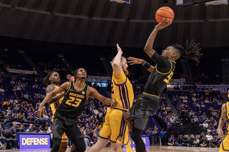 Mar 9, 2024; Baton Rouge, Louisiana, USA; Missouri Tigers guard Sean East II (55) shoots a jump shot against Missouri Tigers guard Jackson Francois (12) during the second half at Pete Maravich Assembly Center. Mandatory Credit: Stephen Lew-USA TODAY Sports