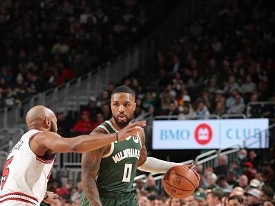 MILWAUKEE, WI - DECEMBER 11:  Damian Lillard #0 of the Milwaukee Bucks handles the ball during the game  on December 11, 2023 at the Fiserv Forum Center in Milwaukee, Wisconsin. NOTE TO USER: User expressly acknowledges and agrees that, by downloading and or using this Photograph, user is consenting to the terms and conditions of the Getty Images License Agreement. Mandatory Copyright Notice: Copyright 2023 NBAE (Photo by Gary Dineen/NBAE via Getty Images).