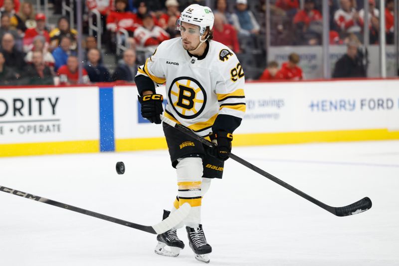 Dec 2, 2025; Detroit, Michigan, USA;  Boston Bruins center Marat Khusnutdinov (92) skates with the puck in the first period against the Detroit Red Wings at Little Caesars Arena. Mandatory Credit: Rick Osentoski-Imagn Images
