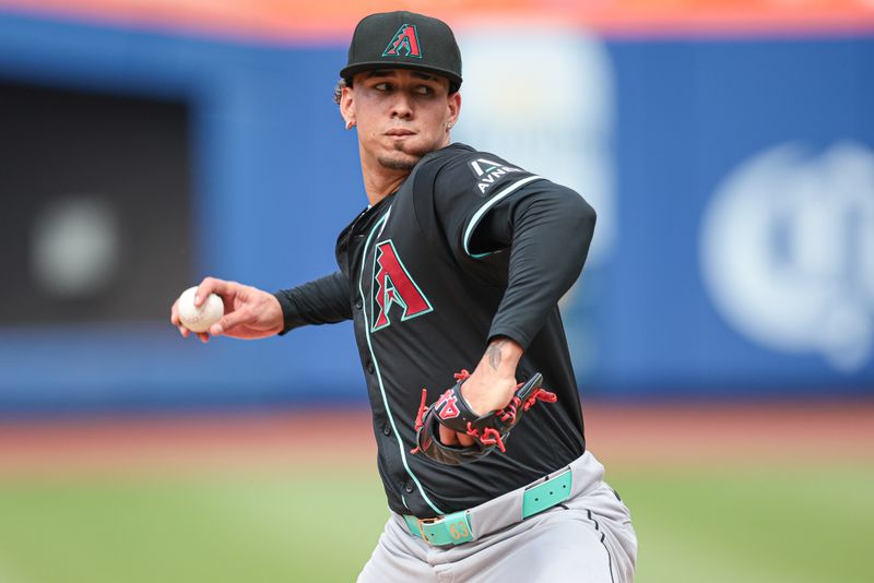 Jun 2, 2024; New York City, New York, USA; Arizona Diamondbacks relief pitcher Justin Martinez (63) delivers a pitch during the eighth inning against the New York Mets at Citi Field. Mandatory Credit: Vincent Carchietta-USA TODAY Sports