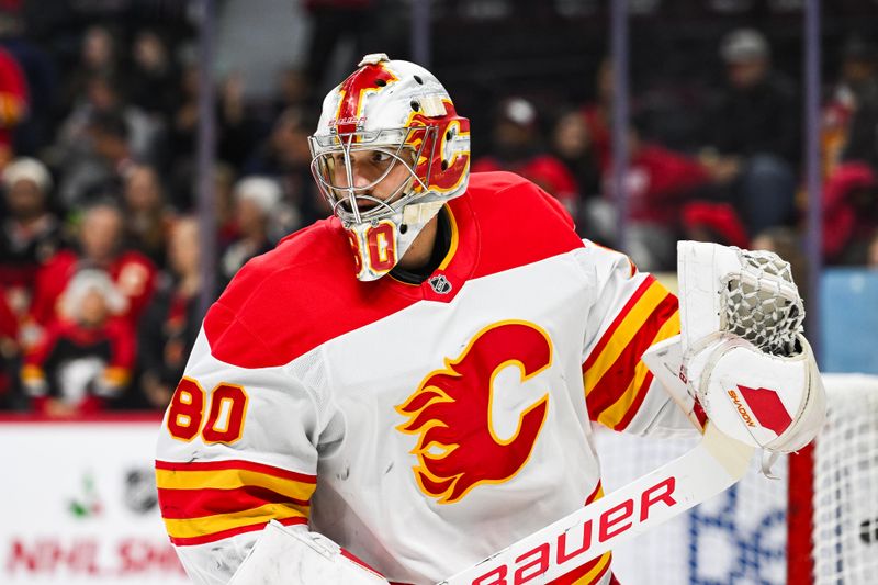 Nov 25, 2024; Ottawa, Ontario, CAN; Calgary Flames goalie Dan Vladar (80) looks on during warm-up before the game against the Ottawa Senators at Canadian Tire Centre. Mandatory Credit: David Kirouac-Imagn Images