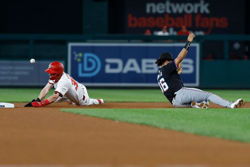 Sep 12, 2024; Washington, District of Columbia, USA; Washington Nationals outfielder Jacob Young (30) steals second base as Miami Marlins infield Javier Sanoja (86) attempts to catch a throw from Marlins catcher Nick Fortes (not pictured) during the fourth inning at Nationals Park. Mandatory Credit: Geoff Burke-Imagn Images