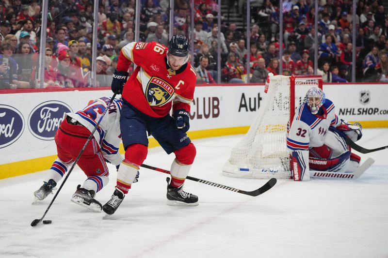 Dec 29, 2023; Sunrise, Florida, USA; Florida Panthers center Aleksander Barkov (16) controls the puck against the New York Rangers during the second period at Amerant Bank Arena. Mandatory Credit: Jasen Vinlove-USA TODAY Sports