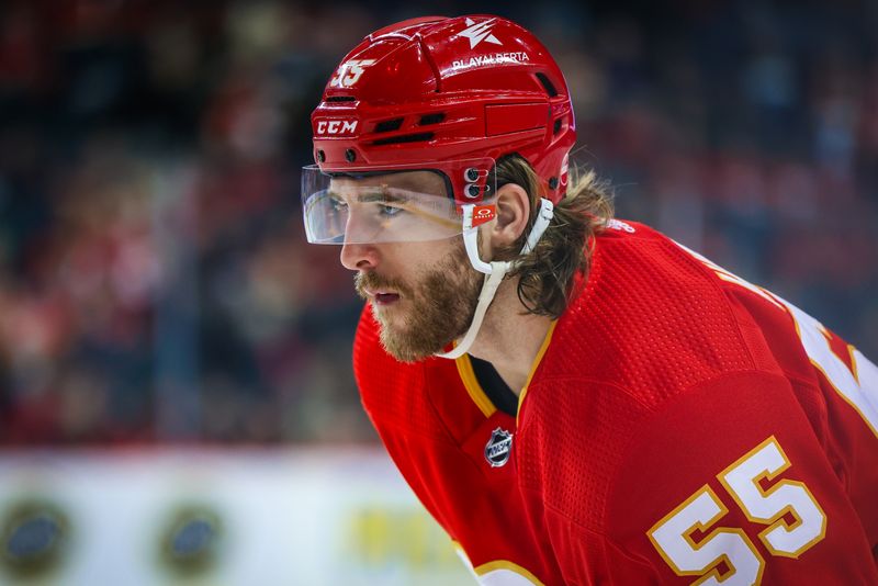 Mar 4, 2024; Calgary, Alberta, CAN; Calgary Flames defenseman Noah Hanifin (55) against the Seattle Kraken during the second period at Scotiabank Saddledome. Mandatory Credit: Sergei Belski-USA TODAY Sports