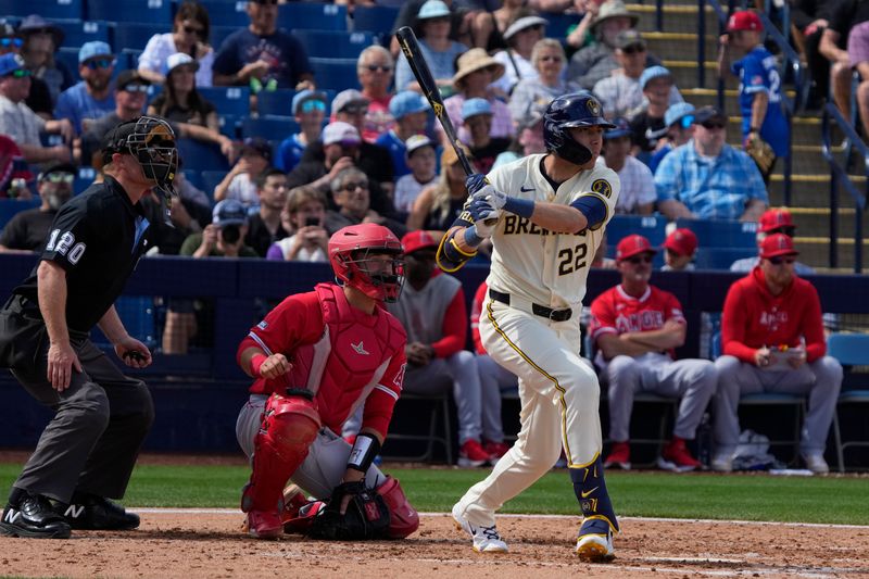 Mar 18, 2024; Phoenix, Arizona, USA; Milwaukee Brewers left fielder Christian Yelich (22) hits a home run against the Los Angeles Angels in the third inning at American Family Fields of Phoenix. Mandatory Credit: Rick Scuteri-USA TODAY Sports