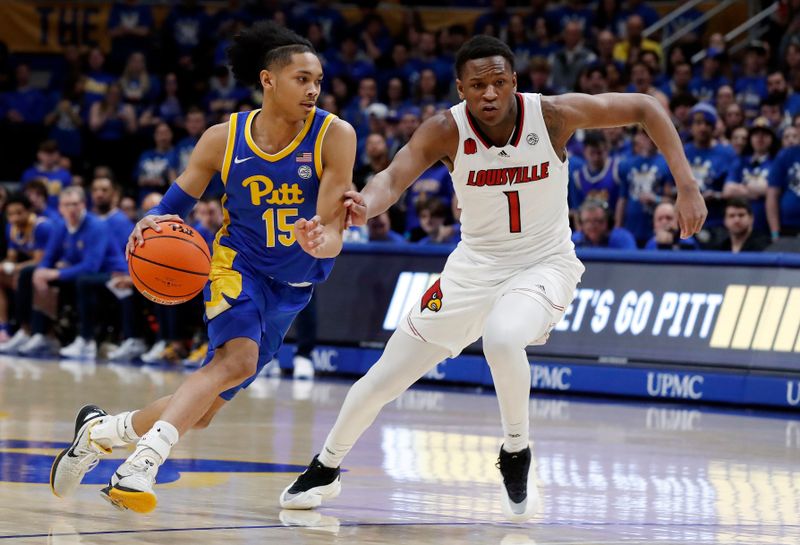 Feb 17, 2024; Pittsburgh, Pennsylvania, USA;  Pittsburgh Panthers guard Jaland Lowe (15) drives to the basket against Louisville Cardinals guard Curtis Williams (1) during the first half at the Petersen Events Center. Mandatory Credit: Charles LeClaire-USA TODAY Sports