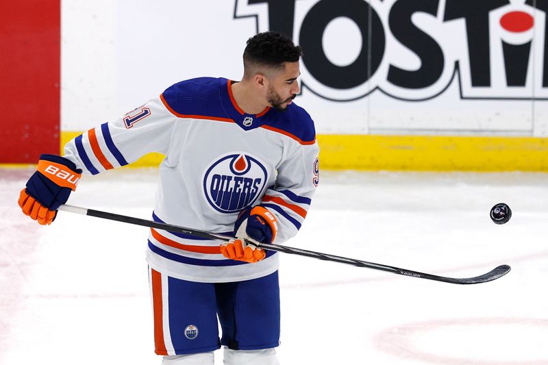 Mar 26, 2024; Winnipeg, Manitoba, CAN; Edmonton Oilers left wing Evander Kane (91) warms  up before a game against the Winnipeg Jets at Canada Life Centre. Mandatory Credit: James Carey Lauder-USA TODAY Sports