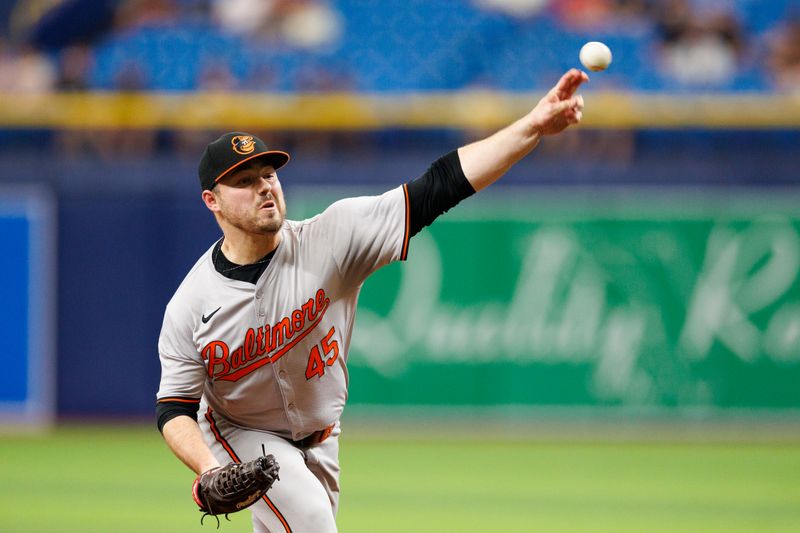 Jun 9, 2024; St. Petersburg, Florida, USA;  Baltimore Orioles pitcher Keegan Akin (45) throws a pitch against the Tampa Bay Rays in the ninth inning at Tropicana Field. Mandatory Credit: Nathan Ray Seebeck-USA TODAY Sports