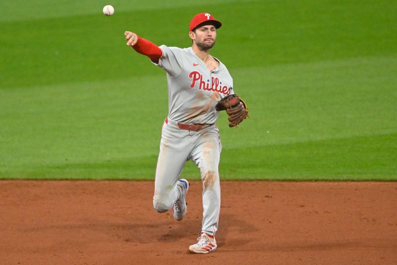 May 9, 2025; Cleveland, Ohio, USA; Philadelphia Phillies shortstop Trea Turner (7) throws to first base in the eighth inning against the Cleveland Guardians at Progressive Field. Mandatory Credit: David Richard-Imagn Images