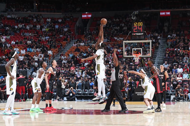 MIAMI, FL - JANUARY 02: Bam Adebayo #13 of the Miami Heat and Myles Turner #33 of the Indiana Pacers go up for the opening tip off on January 02, 2024 at Kaseya Center in Miami, Florida. NOTE TO USER: User expressly acknowledges and agrees that, by downloading and or using this Photograph, user is consenting to the terms and conditions of the Getty Images License Agreement. Mandatory Copyright Notice: Copyright 2024 NBAE (Photo by Jeff Haynes/NBAE via Getty Images)