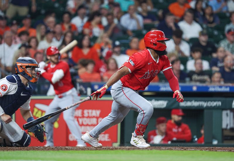 May 21, 2024; Houston, Texas, USA; Los Angeles Angels third baseman Luis Rengifo (2) hits an RBI single during the fourth inning against the Houston Astros at Minute Maid Park. Mandatory Credit: Troy Taormina-USA TODAY Sports