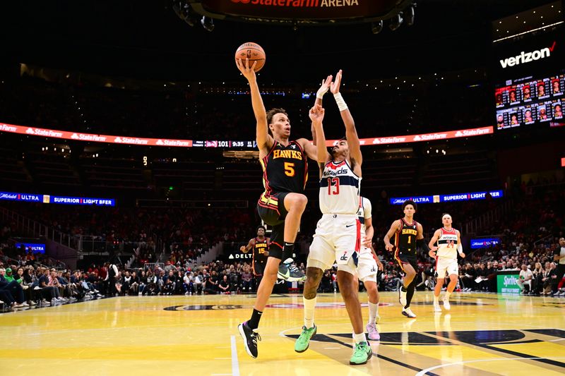 ATLANTA, GA - NOVEMBER 15:  Dyson Daniels #5 of the Atlanta Hawks drives to the basket during the game against the Washington Wizards during the Emirates NBA Cup game on November 15, 2024 at State Farm Arena in Atlanta, Georgia.  NOTE TO USER: User expressly acknowledges and agrees that, by downloading and/or using this Photograph, user is consenting to the terms and conditions of the Getty Images License Agreement. Mandatory Copyright Notice: Copyright 2024 NBAE (Photo by Adam Hagy/NBAE via Getty Images)