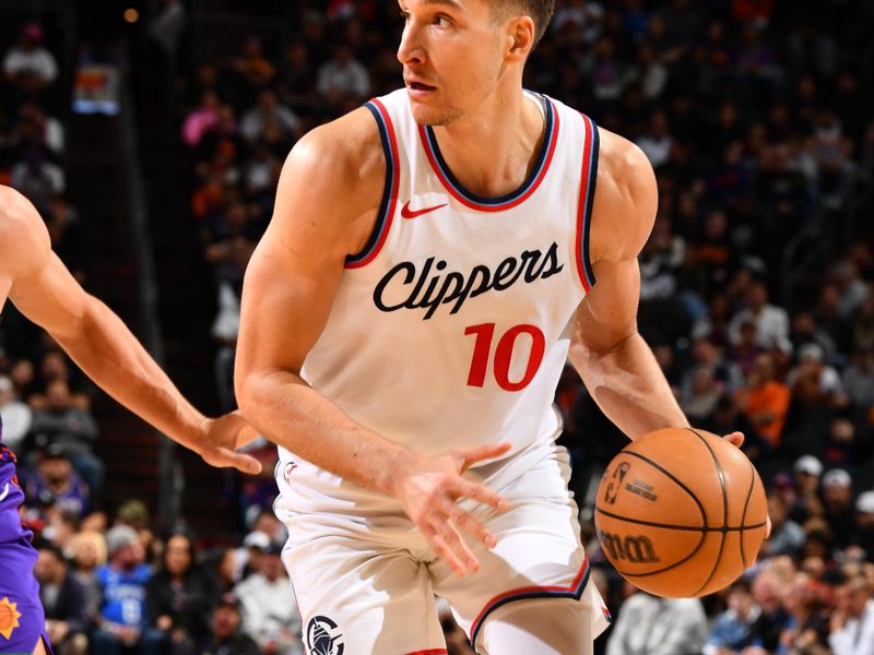 PHOENIX, AZ - MARCH 4:  Bogdan Bogdanovic #10 of the LA Clippers dribbles the ball during the game against the Phoenix Suns   on March 4, 2025 at Footprint Center in Phoenix, Arizona. NOTE TO USER: User expressly acknowledges and agrees that, by downloading and or using this photograph, user is consenting to the terms and conditions of the Getty Images License Agreement. Mandatory Copyright Notice: Copyright 2025 NBAE (Photo by Barry Gossage/NBAE via Getty Images)