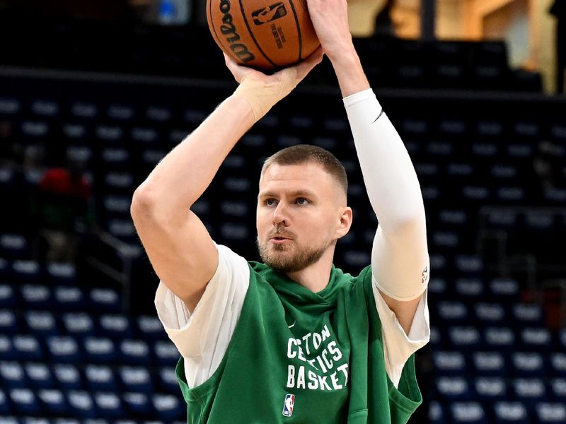 WASHINGTON, DC - OCTOBER 30: Kristaps Porzingis #8 of the Boston Celtics warms up before the game against the Washington Wizards at Capital One Arena on October 30, 2023 in Washington, DC.  NOTE TO USER: User expressly acknowledges and agrees that, by downloading and or using this photograph, User is consenting to the terms and conditions of the Getty Images License Agreement.  (Photo by Greg Fiume/Getty Images)