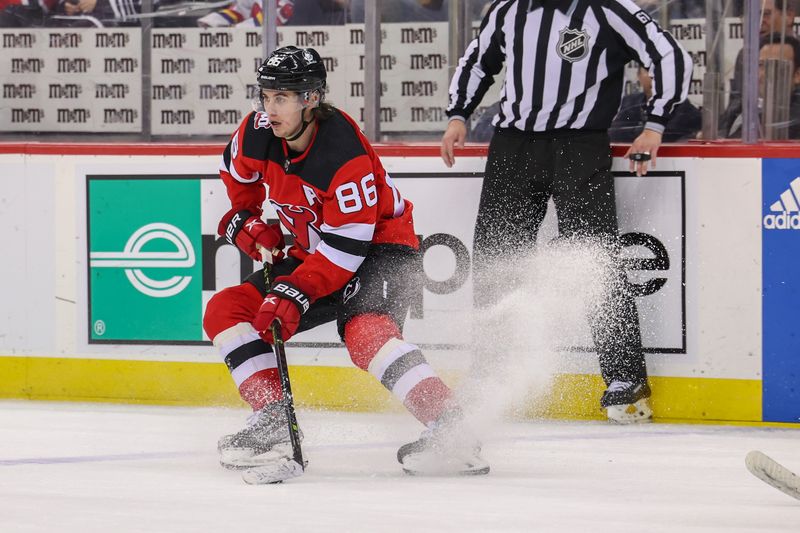 Feb 23, 2023; Newark, New Jersey, USA; New Jersey Devils center Jack Hughes (86) skates with the puck against the Los Angeles Kings during the second period at Prudential Center. Mandatory Credit: Ed Mulholland-USA TODAY Sports