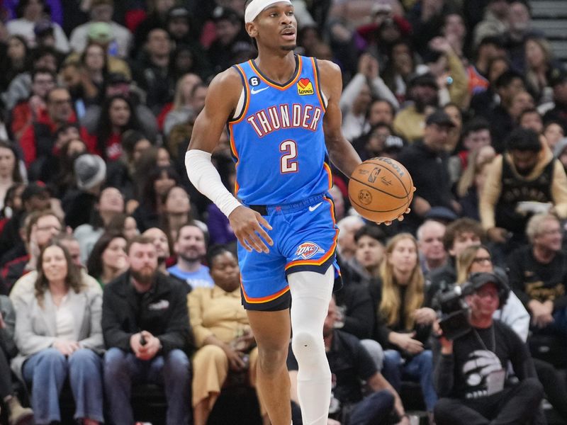 TORONTO, ON - MARCH 16: Shai Gilgeous-Alexander #2 of the Oklahoma City Thunder dribbles against the Toronto Raptors during the first half of their basketball game at the Scotiabank Arena on March 16, 2023 in Toronto, Ontario, Canada. NOTE TO USER: User expressly acknowledges and agrees that, by downloading and/or using this Photograph, user is consenting to the terms and conditions of the Getty Images License Agreement. (Photo by Mark Blinch/Getty Images)