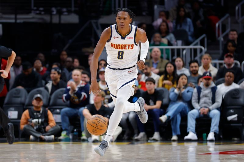 ATLANTA, GEORGIA - DECEMBER 08: Peyton Watson #8 of the Denver Nuggets drives down the court during the first quarter against the Atlanta Hawks at State Farm Arena on December 8, 2024 in Atlanta, Georgia. NOTE TO USER: User expressly acknowledges and agrees that, by downloading and or using this photograph, User is consenting to the terms and conditions of the Getty Images License Agreement. (Photo by Todd Kirkland/Getty Images)