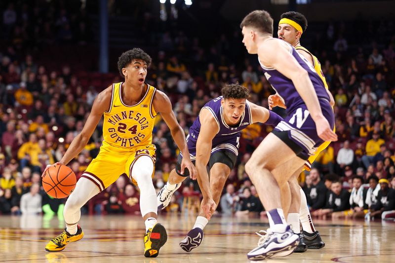 Feb 3, 2024; Minneapolis, Minnesota, USA; Minnesota Golden Gophers guard Cam Christie (24) works around Northwestern Wildcats guard Ty Berry (3) during the first half at Williams Arena. Mandatory Credit: Matt Krohn-USA TODAY Sports