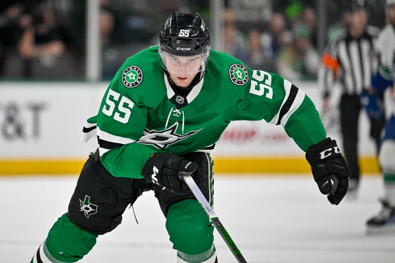 Dec 21, 2023; Dallas, Texas, USA; Dallas Stars defenseman Thomas Harley (55) chases the puck during the first period against the Vancouver Canucks at the American Airlines Center. Mandatory Credit: Jerome Miron-USA TODAY Sports