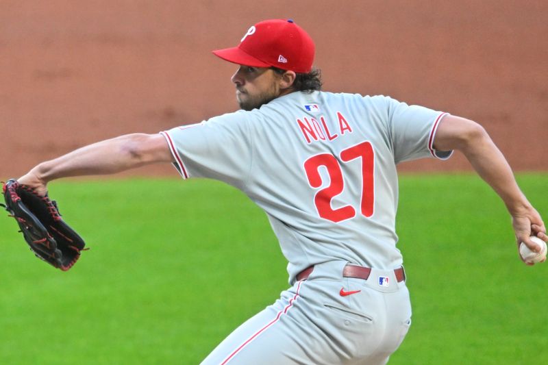 May 9, 2025; Cleveland, Ohio, USA; Philadelphia Phillies starting pitcher Aaron Nola (27) delivers a pitch in the first inning against the Cleveland Guardians at Progressive Field. Mandatory Credit: David Richard-Imagn Images