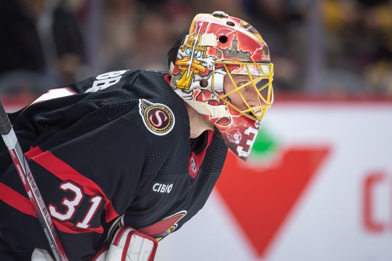 Dec 23, 2023; Ottawa, Ontario, CAN; Ottawa Senators goalie Anton Forsberg (31) looks up the ice prior to the start of the second period against the Pittsburgh Penguins at the Canadian Tire Centre. Mandatory Credit: Marc DesRosiers-USA TODAY Sports