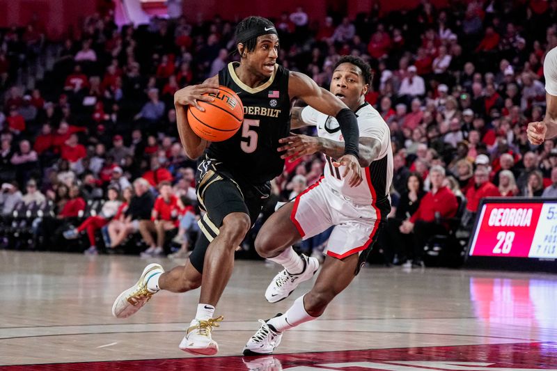 Jan 21, 2023; Athens, Georgia, USA; Vanderbilt Commodores guard Ezra Manjon (5) dribbles the ball past Georgia Bulldogs guard Justin Hill (11) during the first half at Stegeman Coliseum. Mandatory Credit: Dale Zanine-USA TODAY Sports