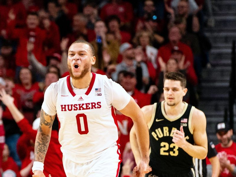 Jan 9, 2024; Lincoln, Nebraska, USA; Nebraska Cornhuskers guard C.J. Wilcher (0) celebrates after a three-point shot against Purdue Boilermakers forward Camden Heide (23) during the second half at Pinnacle Bank Arena. Mandatory Credit: Dylan Widger-USA TODAY Sports