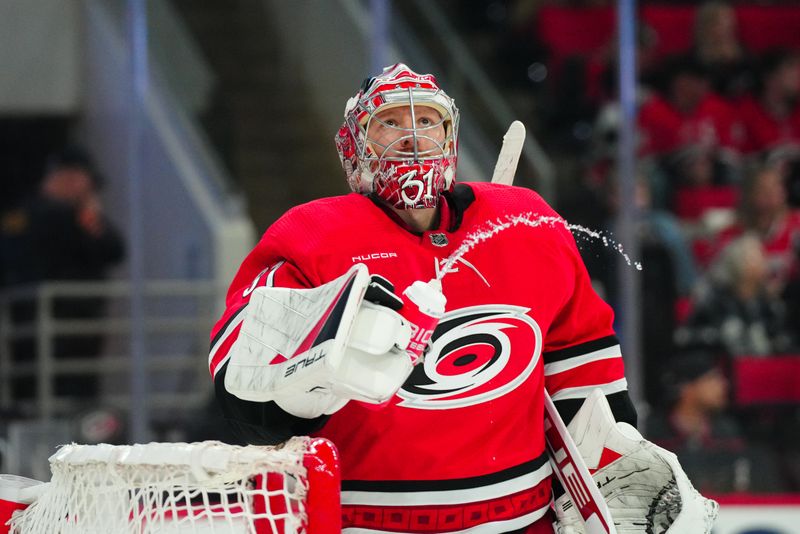 Mar 21, 2024; Raleigh, North Carolina, USA; Carolina Hurricanes goaltender Frederik Andersen (31) looks on against the Philadelphia Flyers during the second period at PNC Arena. Mandatory Credit: James Guillory-USA TODAY Sports