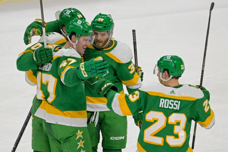 Feb 17, 2024; Saint Paul, Minnesota, USA;  Minnesota Wild defenseman Declan Chisholm (47) celebrates his power play goal against the Buffalo Sabres with forward Marcus Johansson (90), forward Ryan Hartman (38), and forward Marco Rossi (23) during the third period at Xcel Energy Center. Mandatory Credit: Nick Wosika-USA TODAY Sports