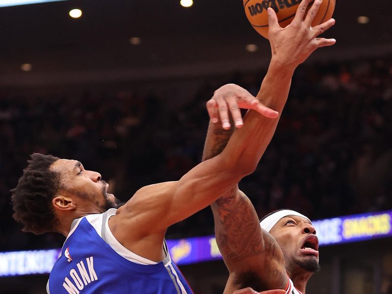 CHICAGO, ILLINOIS - FEBRUARY 03: Torrey Craig #13 of the Chicago Bulls fouls Malik Monk #0 of the Sacramento Kings during the first half at the United Center on February 03, 2024 in Chicago, Illinois. NOTE TO USER: User expressly acknowledges and agrees that, by downloading and or using this photograph, User is consenting to the terms and conditions of the Getty Images License Agreement.  (Photo by Michael Reaves/Getty Images)