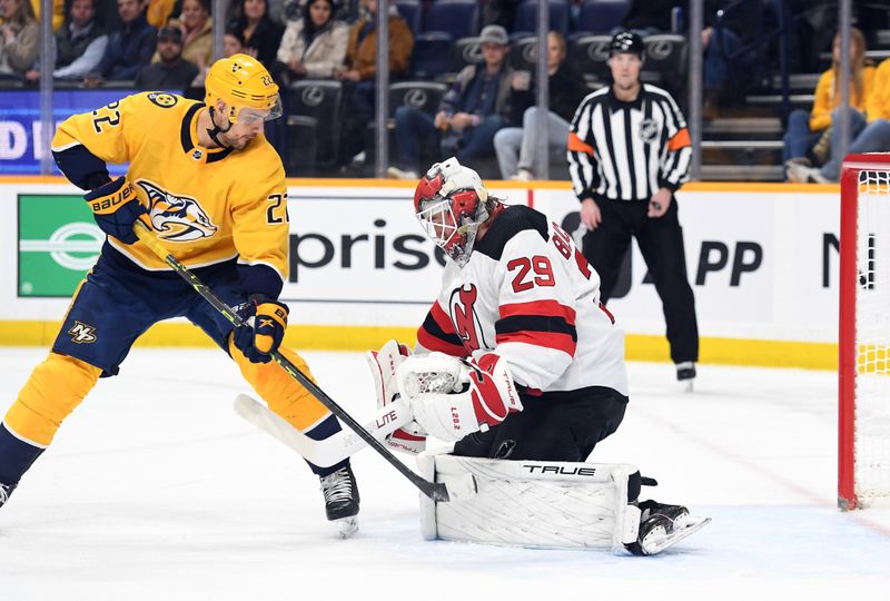 Jan 26, 2023; Nashville, Tennessee, USA; Nashville Predators right wing Nino Niederreiter (22) has a shot blocked by New Jersey Devils goaltender Mackenzie Blackwood (29) during the first period at Bridgestone Arena. Mandatory Credit: Christopher Hanewinckel-USA TODAY Sports