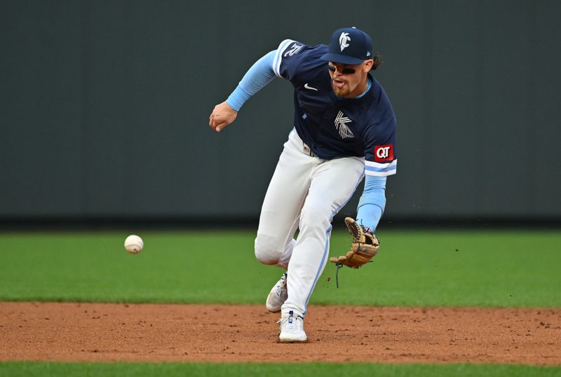 May 31, 2024; Kansas City, Missouri, USA;  Kansas City Royals shortstop Bobby Witt Jr. (7) fields a ground ball in the third inning against the San Diego Padres at Kauffman Stadium. Mandatory Credit: Peter Aiken-USA TODAY Sports