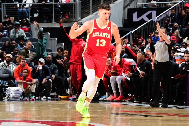 ATLANTA, GA - JANUARY 3: Bogdan Bogdanovic #13 of the Atlanta Hawks reacts during the game against the Oklahoma City Thunder on January 3, 2024 at State Farm Arena in Atlanta, Georgia.  NOTE TO USER: User expressly acknowledges and agrees that, by downloading and/or using this Photograph, user is consenting to the terms and conditions of the Getty Images License Agreement. Mandatory Copyright Notice: Copyright 2024 NBAE (Photo by Scott Cunningham/NBAE via Getty Images)