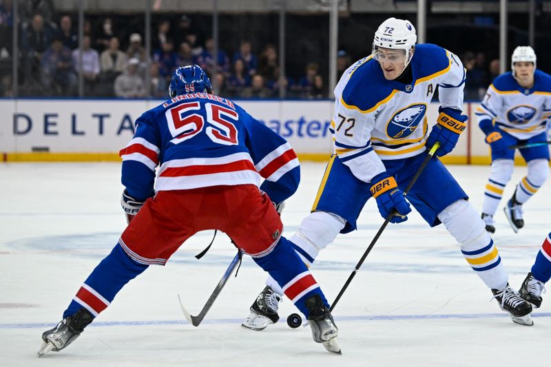 Nov 7, 2024; New York, New York, USA;  Buffalo Sabres center Tage Thompson (72) skates the puck into the zone defended by New York Rangers defenseman Ryan Lindgren (55) during the first period at Madison Square Garden. Mandatory Credit: Dennis Schneidler-Imagn Images