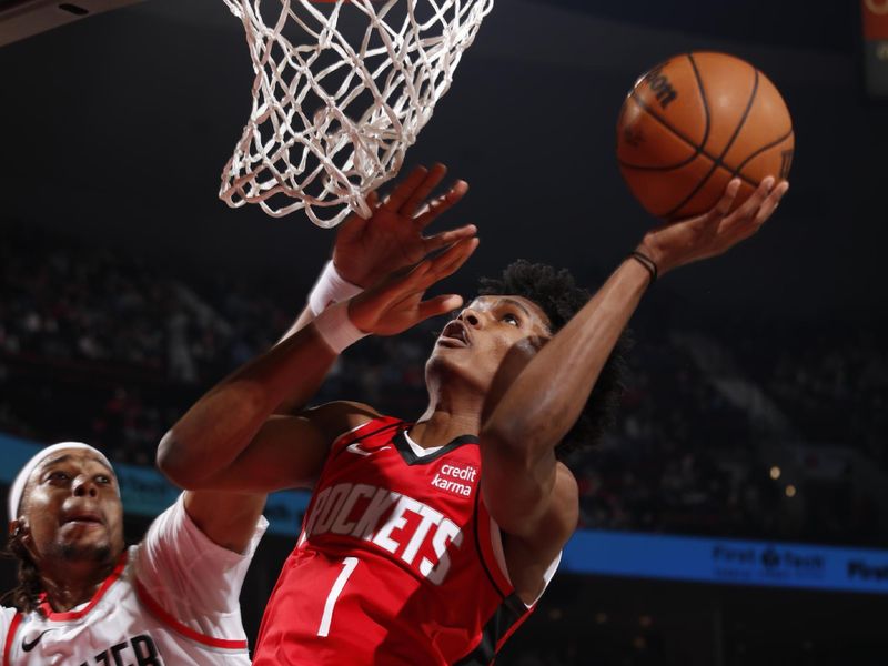 PORTLAND, OR - MARCH 8:  Amen Thompson #1 of the Houston Rockets goes to the basket during the game on March 8, 2024 at the Moda Center Arena in Portland, Oregon. NOTE TO USER: User expressly acknowledges and agrees that, by downloading and or using this photograph, user is consenting to the terms and conditions of the Getty Images License Agreement. Mandatory Copyright Notice: Copyright 2024 NBAE (Photo by Cameron Browne/NBAE via Getty Images)