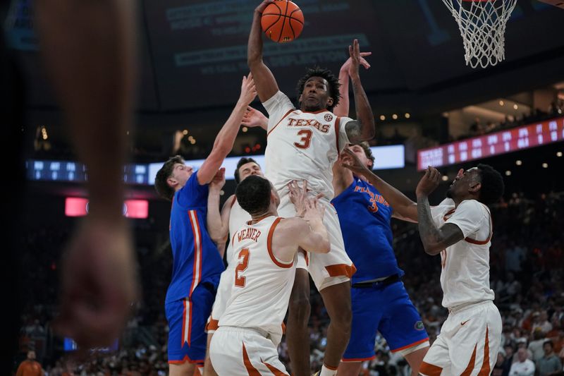 Feb 25, 2026; Austin, Texas, USA; Texas Longhorns guard Dailyn Swain (3) rebounds during the second half against the Florida Gators at Moody Center. Mandatory Credit: Dustin Safranek-Imagn Images