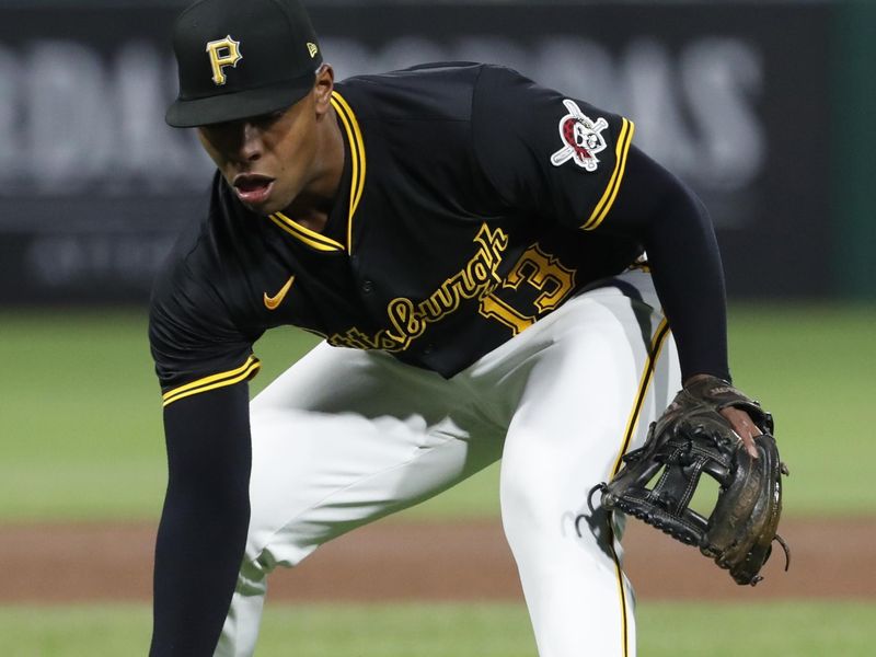 Apr 24, 2024; Pittsburgh, Pennsylvania, USA;  Pittsburgh Pirates third base Ke'Bryan Hayes (13) fields a ground ball for an out against  Milwaukee Brewers outfielder Jackson Chourio (not pictured) during the sixth inning at PNC Park. Mandatory Credit: Charles LeClaire-USA TODAY Sports