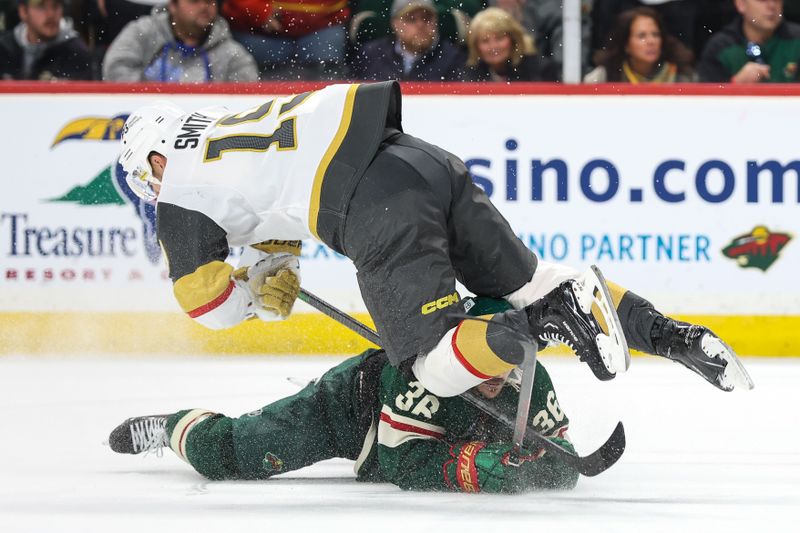 Apr 3, 2023; Saint Paul, Minnesota, USA; Vegas Golden Knights right wing Reilly Smith (19) and Minnesota Wild right wing Mats Zuccarello (36) collide during overtime at Xcel Energy Center. Mandatory Credit: Matt Krohn-USA TODAY Sports