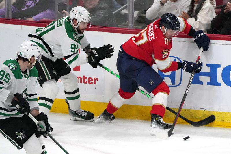 iDec 6, 2023; Sunrise, Florida, USA; Florida Panthers center Evan Rodrigues (17) gathers the puck as Dallas Stars center Tyler Seguin (91) closes in during the third period at Amerant Bank Arena. Mandatory Credit: Jim Rassol-USA TODAY Sports