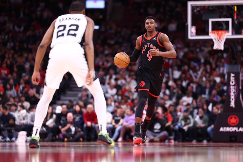 TORONTO, CANADA - MARCH 23:  RJ Barrett #9 of the Toronto Raptors handles the ball during the game against the San Antonio Spurs on March 23, 2025 at the Scotiabank Arena in Toronto, Ontario, Canada.  NOTE TO USER: User expressly acknowledges and agrees that, by downloading and or using this Photograph, user is consenting to the terms and conditions of the Getty Images License Agreement.  Mandatory Copyright Notice: Copyright 2025 NBAE (Photo by Vaughn Ridley/NBAE via Getty Images)