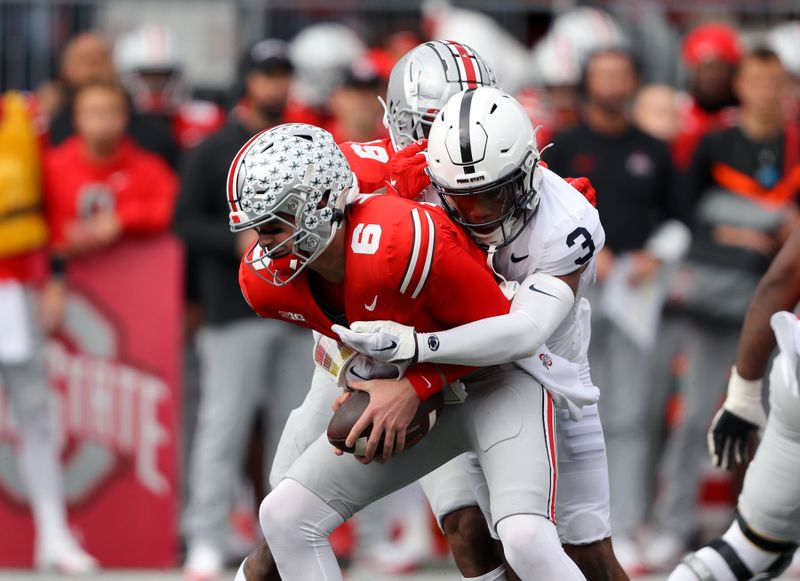 Oct 21, 2023; Columbus, Ohio, USA; Ohio State Buckeyes quarterback Kyle McCord (6) is sacked by Penn State Nittany Lions cornerback Johnny Dixon (3) during the second quarter at Ohio Stadium. Mandatory Credit: Joseph Maiorana-USA TODAY Sports