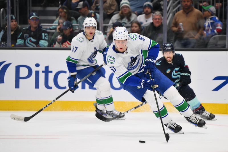 Nov 24, 2023; Seattle, Washington, USA; Vancouver Canucks defenseman Tyler Myers (57) plays the puck against the Seattle Kraken during the second period at Climate Pledge Arena. Mandatory Credit: Steven Bisig-USA TODAY Sports