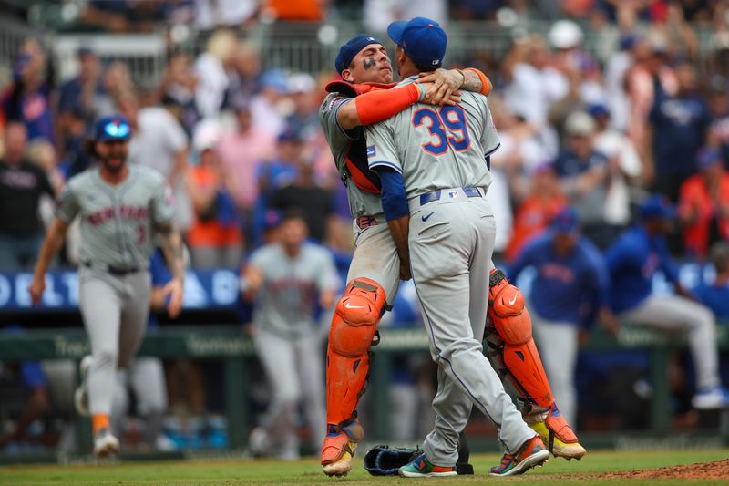 Sep 30, 2024; Atlanta, Georgia, USA; New York Mets catcher Francisco Alvarez (4) jumps onto relief pitcher Edwin Diaz (39) after a victory over the Atlanta Braves and clinching a wild card playoff birth at Truist Park. Mandatory Credit: Brett Davis-Imagn Images