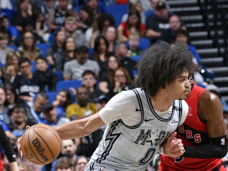 ORLANDO, FL - MARCH 2: Anthony Black #0 of the Orlando Magic dribbles the ball during the game against the Toronto Raptors on March 2, 2025 at Kia Center in Orlando, Florida. NOTE TO USER: User expressly acknowledges and agrees that, by downloading and or using this photograph, User is consenting to the terms and conditions of the Getty Images License Agreement. Mandatory Copyright Notice: Copyright 2025 NBAE (Photo by Fernando Medina/NBAE via Getty Images)