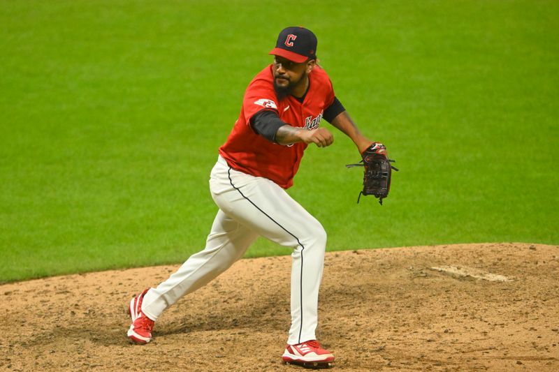 Aug 13, 2024; Cleveland, Ohio, USA; Cleveland Guardians relief pitcher Emmanuel Clase (48) follows through on a pitch in the ninth inning against the Chicago Cubs at Progressive Field. Mandatory Credit: David Richard-USA TODAY Sports