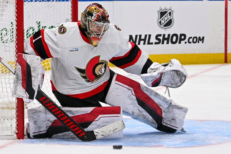 Jan 14, 2025; Elmont, New York, USA;  Ottawa Senators goaltender Leevi Merilainen (1) makes a save against the New York Islanders during the second period at UBS Arena. Mandatory Credit: Dennis Schneidler-Imagn Images